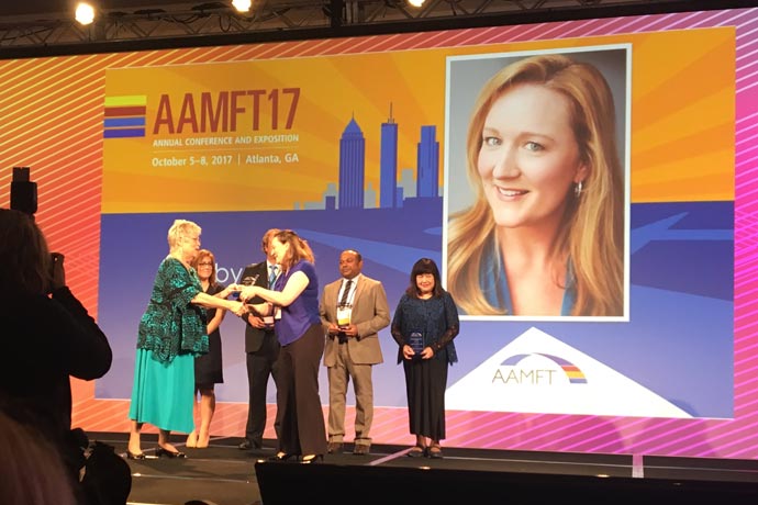 Shelby Riley accepts award at AAMFT17 conference